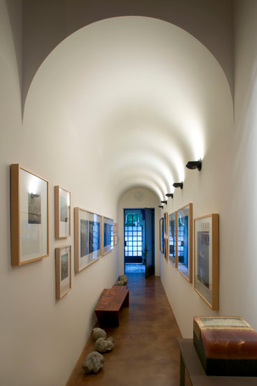 Barrel vault featuring indirect lighting for gallery within custom loft for architect Barry Berkus, AIA, lighting by Trish Odenthal.